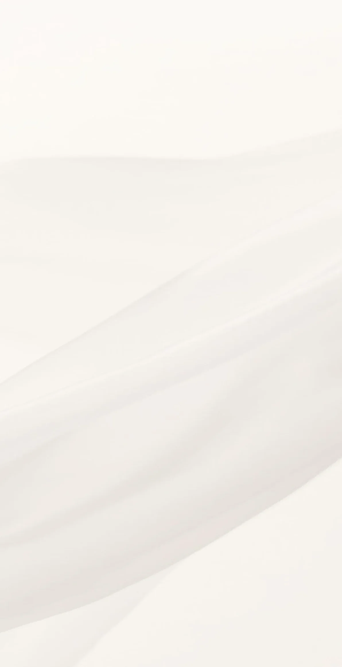 White fabric texture with soft folds and creases creating subtle shadows and diagonal lines