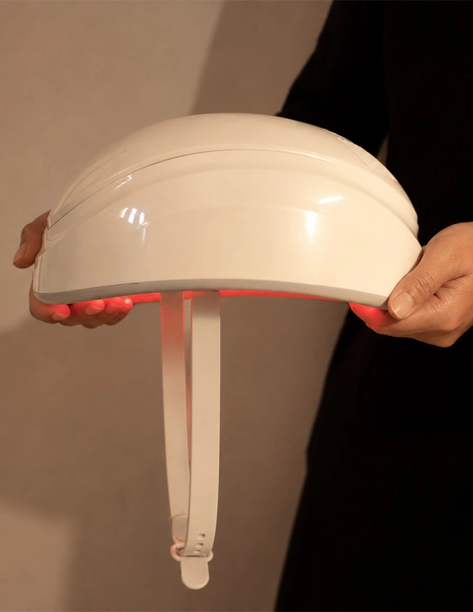 Person holding disassembled white mushroom table lamp showing dome shade and base components - Laser cap in Wayne, PA